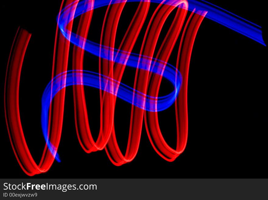 Some colrful LED lights in motion resembling ribbons. Some colrful LED lights in motion resembling ribbons