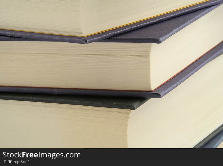 Stack of books against a white background