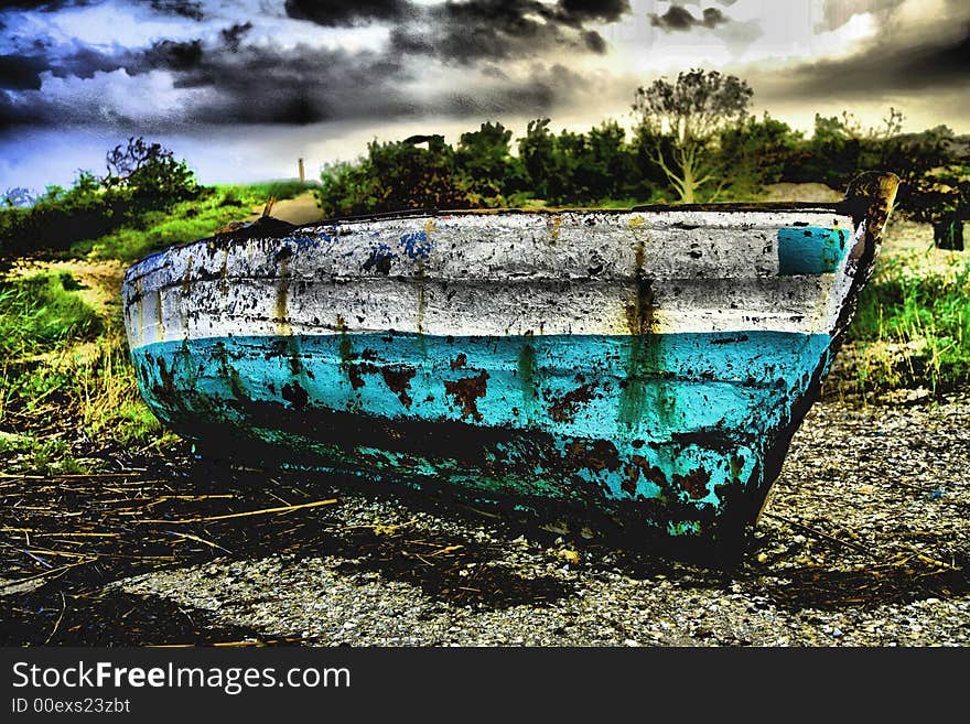 Green and White Sailing boat stranded at low tide in ocean at Vilanculos, Mozambique with artistic retouching. Green and White Sailing boat stranded at low tide in ocean at Vilanculos, Mozambique with artistic retouching