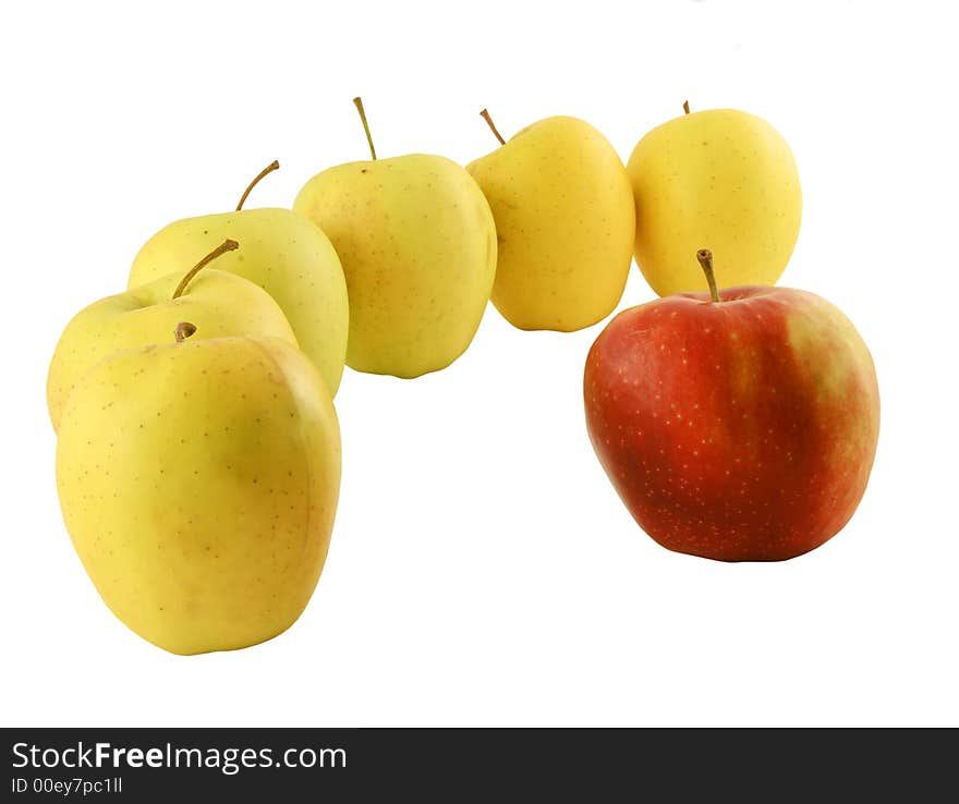 Yellow apples and a red one set on a white background