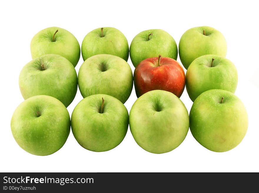 Green apples and a red one set on a white background