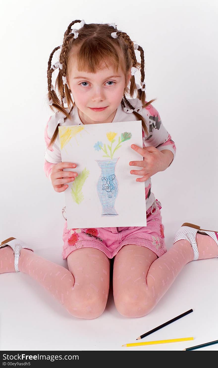 The girl shows the figure on a white background. The girl shows the figure on a white background