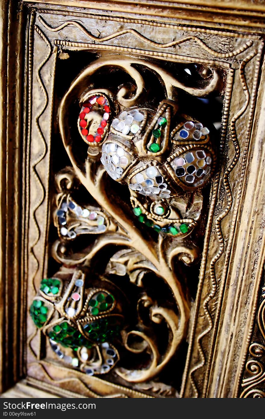 Gold and jewel detail on a temple in Bangkok, Thailand. Gold and jewel detail on a temple in Bangkok, Thailand