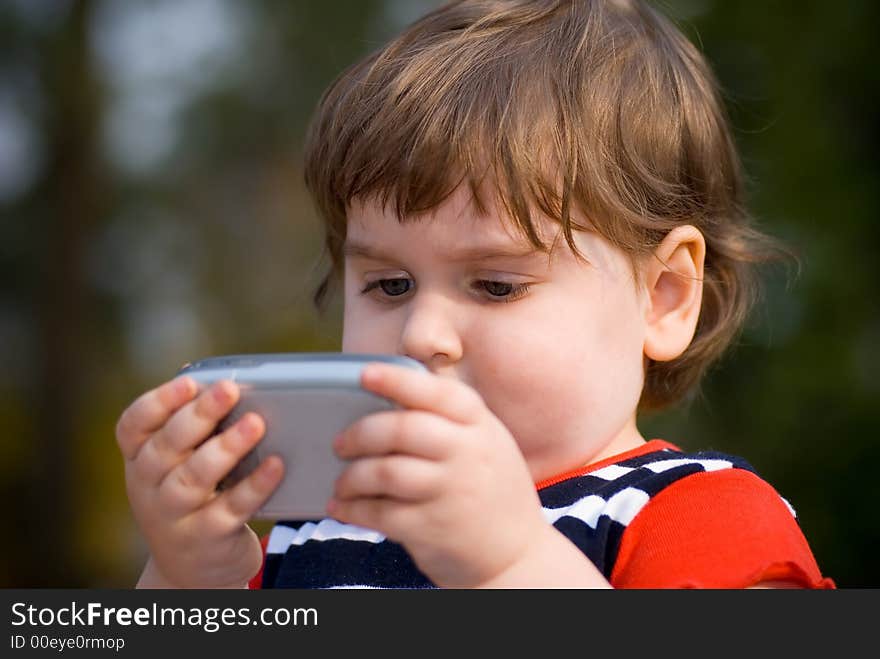 Small child playing on pocketpc. Small child playing on pocketpc