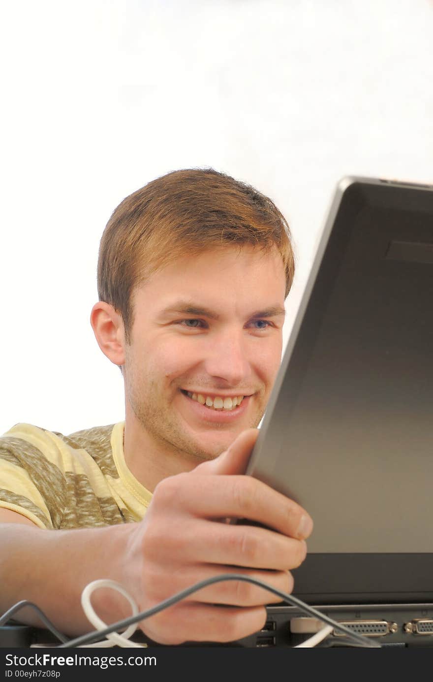 Portrait of young businessman working on computer on white background. Portrait of young businessman working on computer on white background