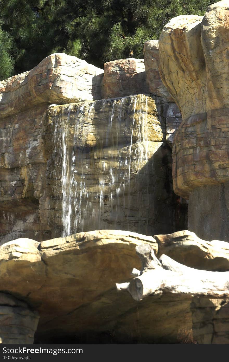 A photo of a small, water poor waterfall