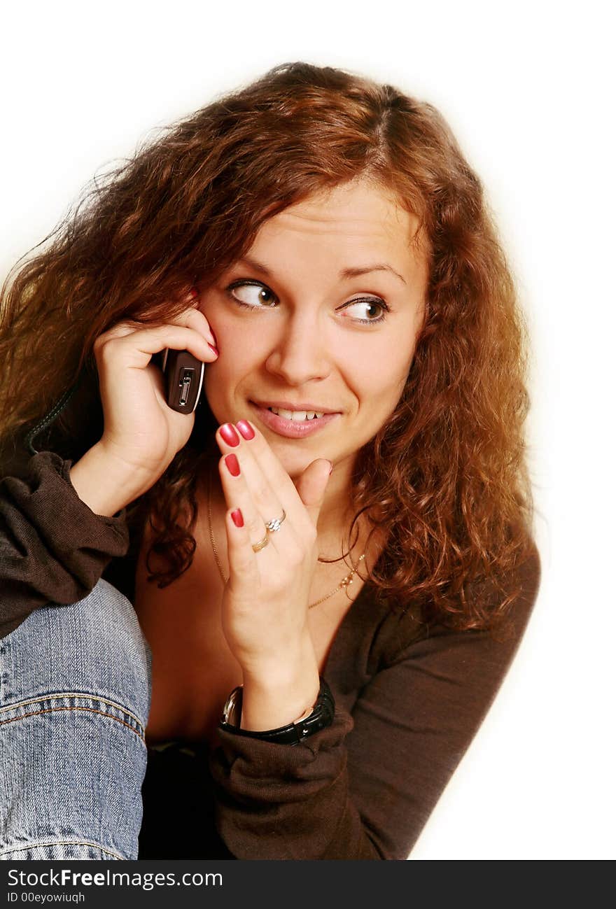 Pretty smiling brunette with the phone. Pretty smiling brunette with the phone