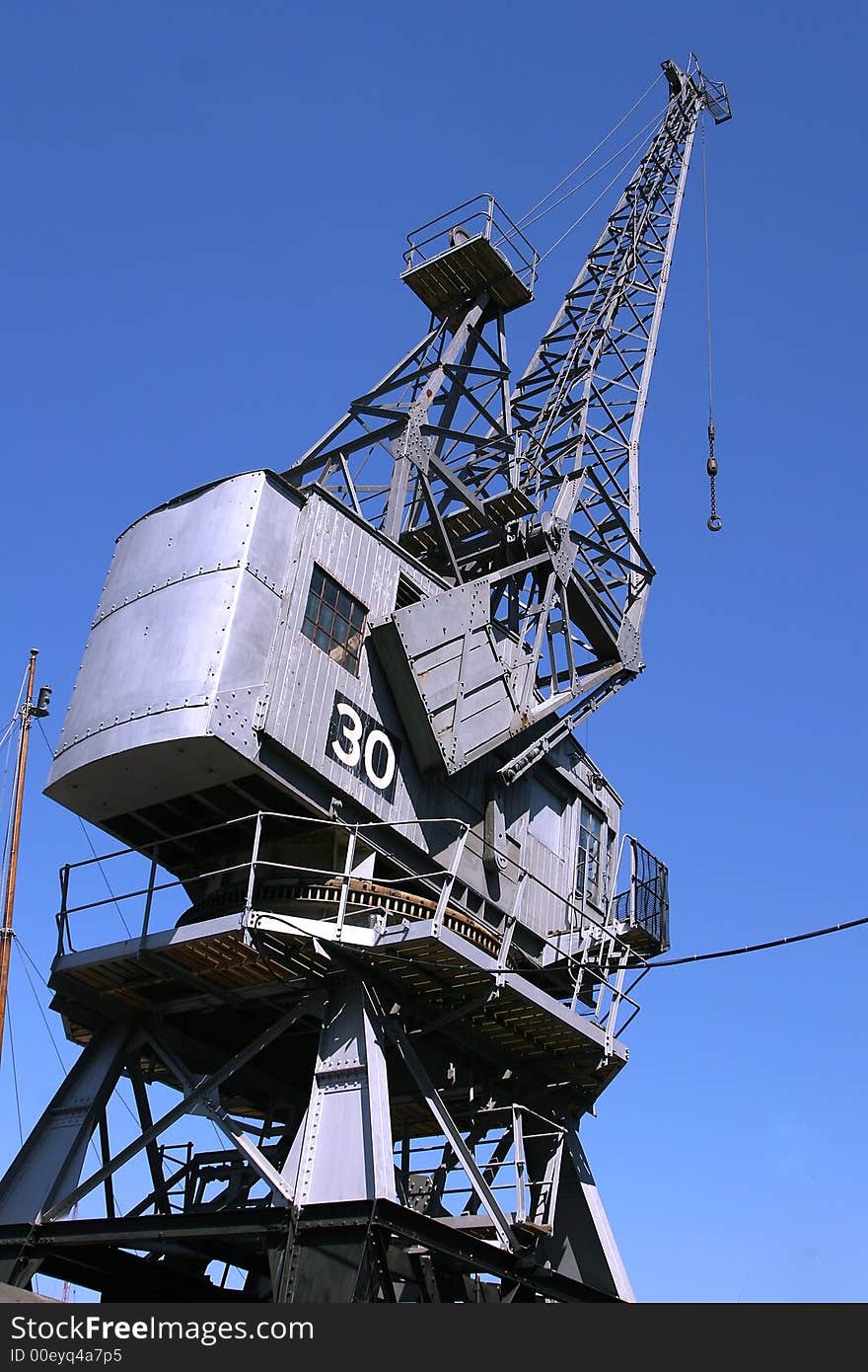 Tall dock crane, against a clear blue sky