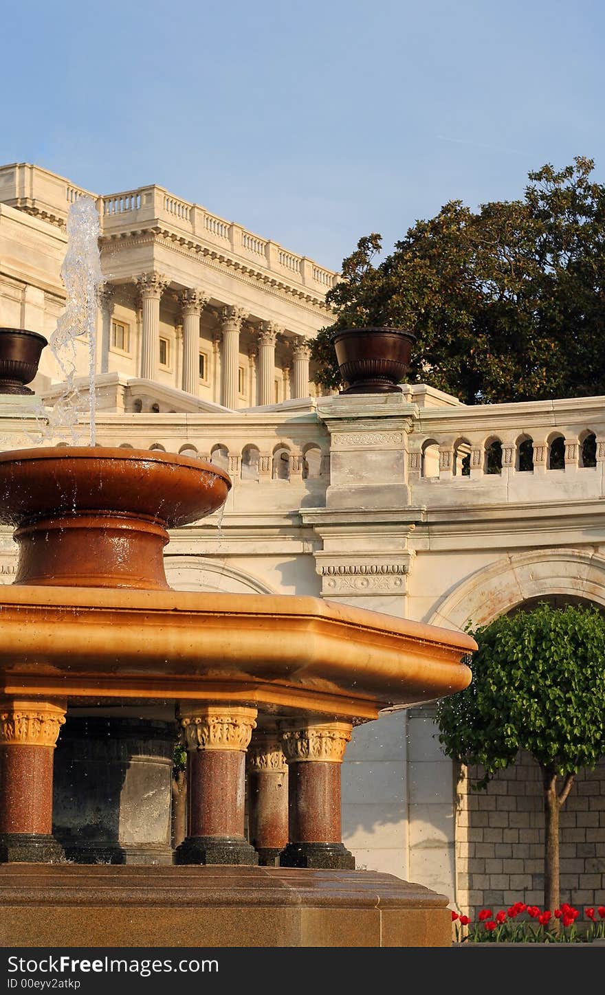 A fountain in the yard of the Capitol building in Washington DC at sunset. A fountain in the yard of the Capitol building in Washington DC at sunset.