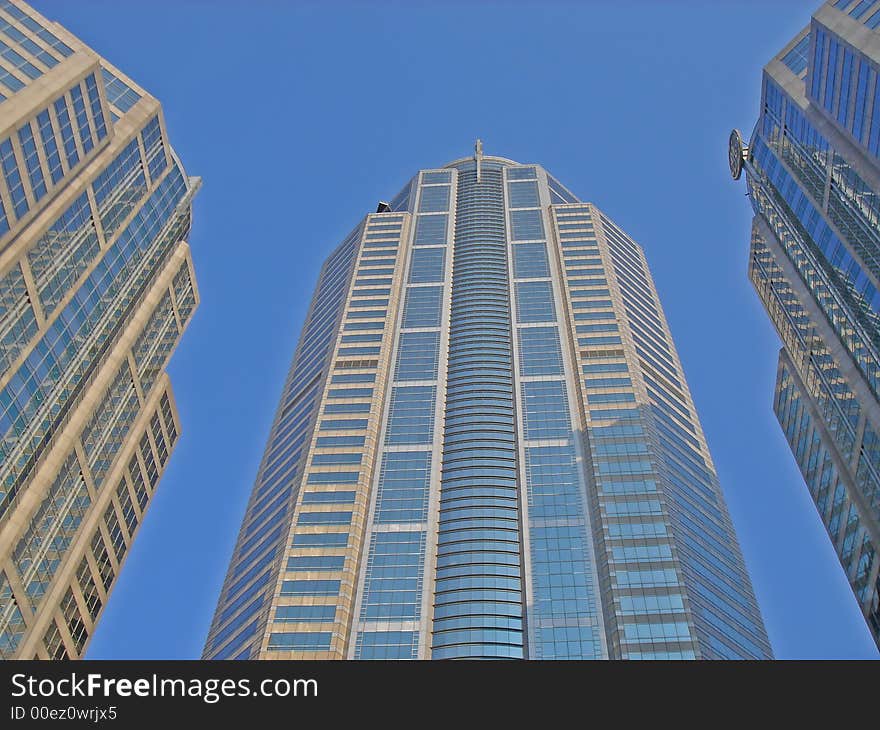 Tall and modern office tower in downtown area. Tall and modern office tower in downtown area