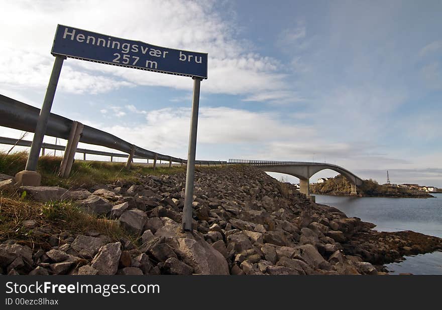 Signage: Henningsvaer bru, Norway landscape with bridge and sign