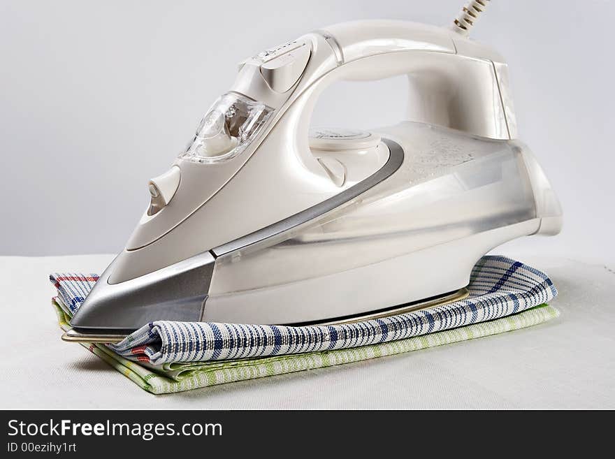 White iron and towels-symbols of neatness and cleanliness