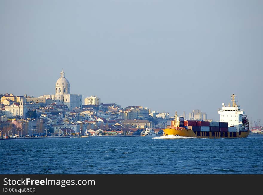 Cargo boat arriving to the dock of lisbon