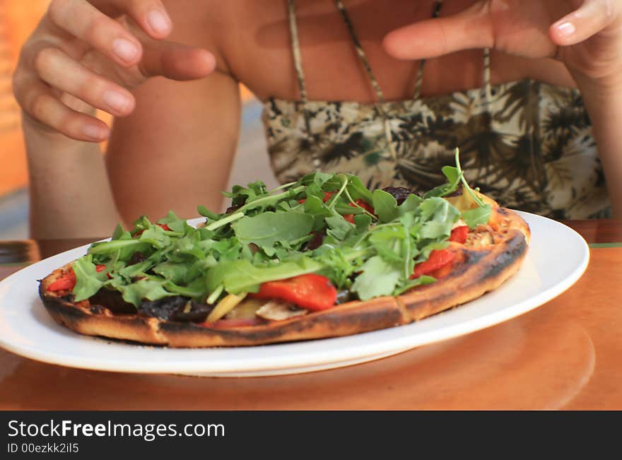 Pizza obsession - hands reaching out to eat it all at once!