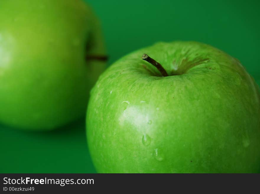 Healthy diet, Green apple with green background. Healthy diet, Green apple with green background