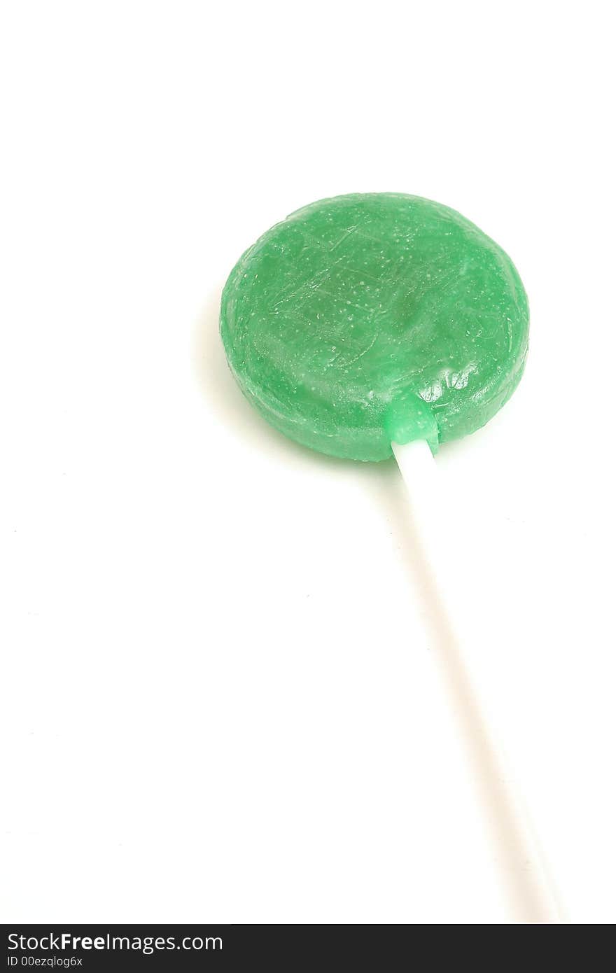 Picture of a green lollipop on white