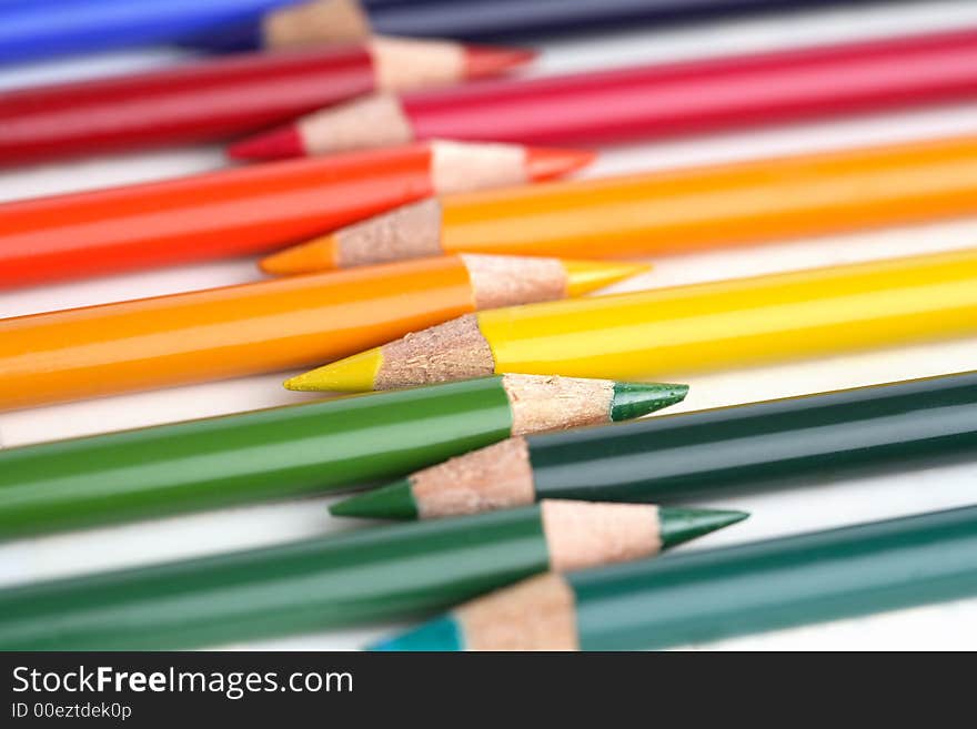 Some coloured crayons and a white background