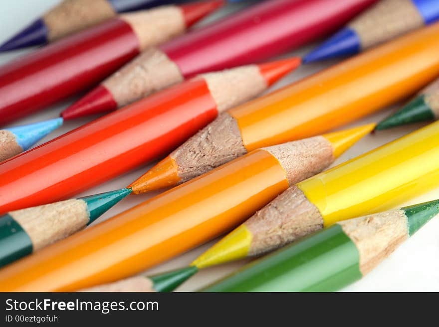 Some coloured crayons and a white background