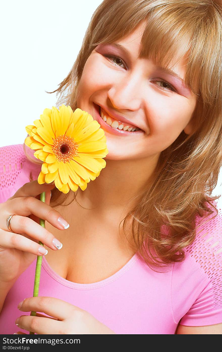 Young women in pink holding a yellow flower isolated on white background. Young women in pink holding a yellow flower isolated on white background