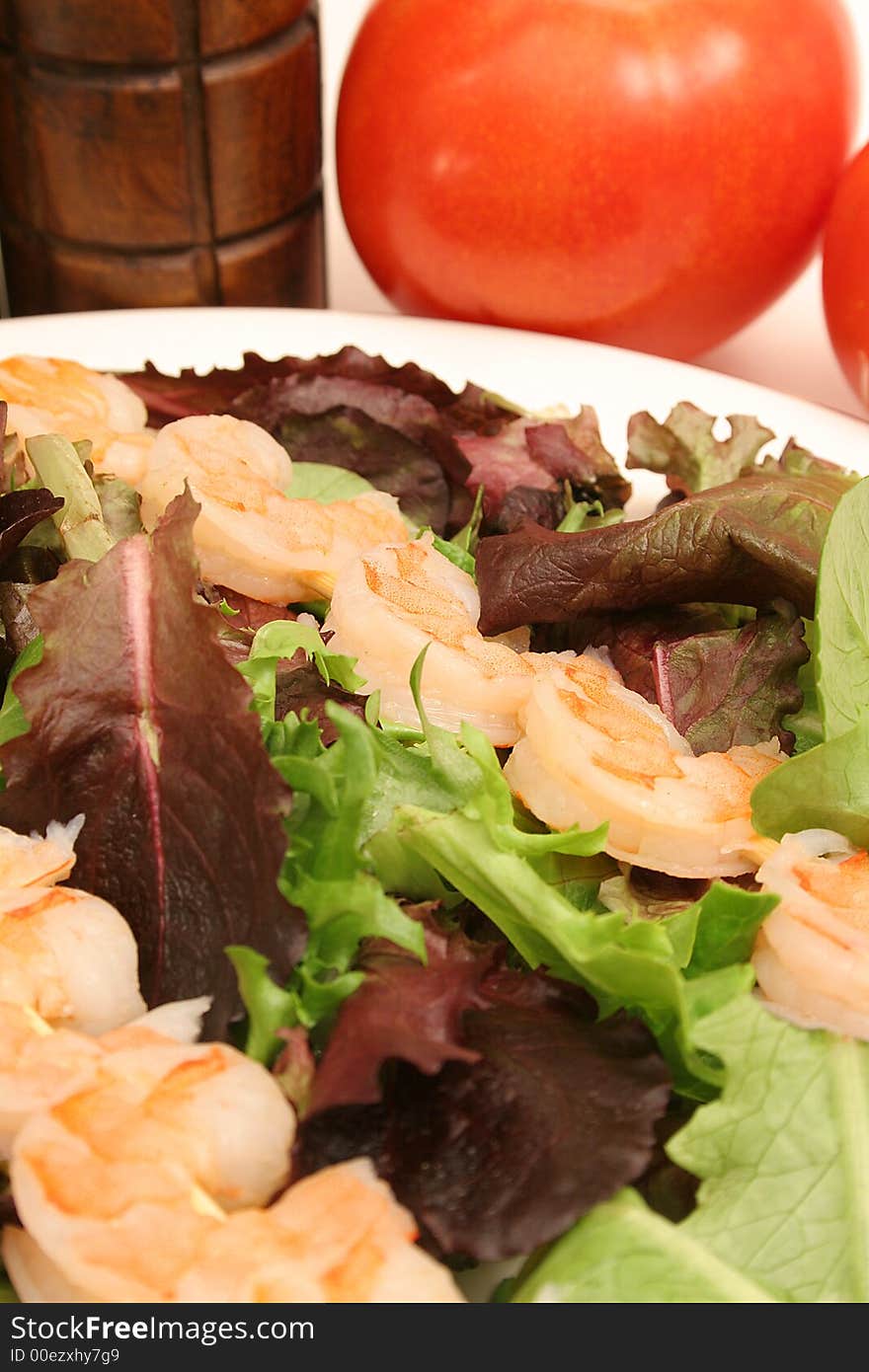 Shrimp skewers on salad vertic