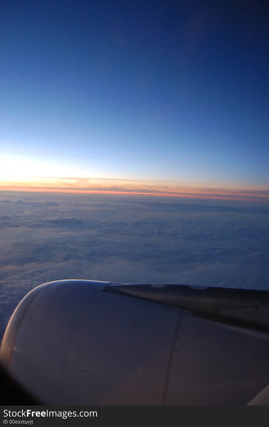 Top view from the wing of a airplane at sunrise. Top view from the wing of a airplane at sunrise