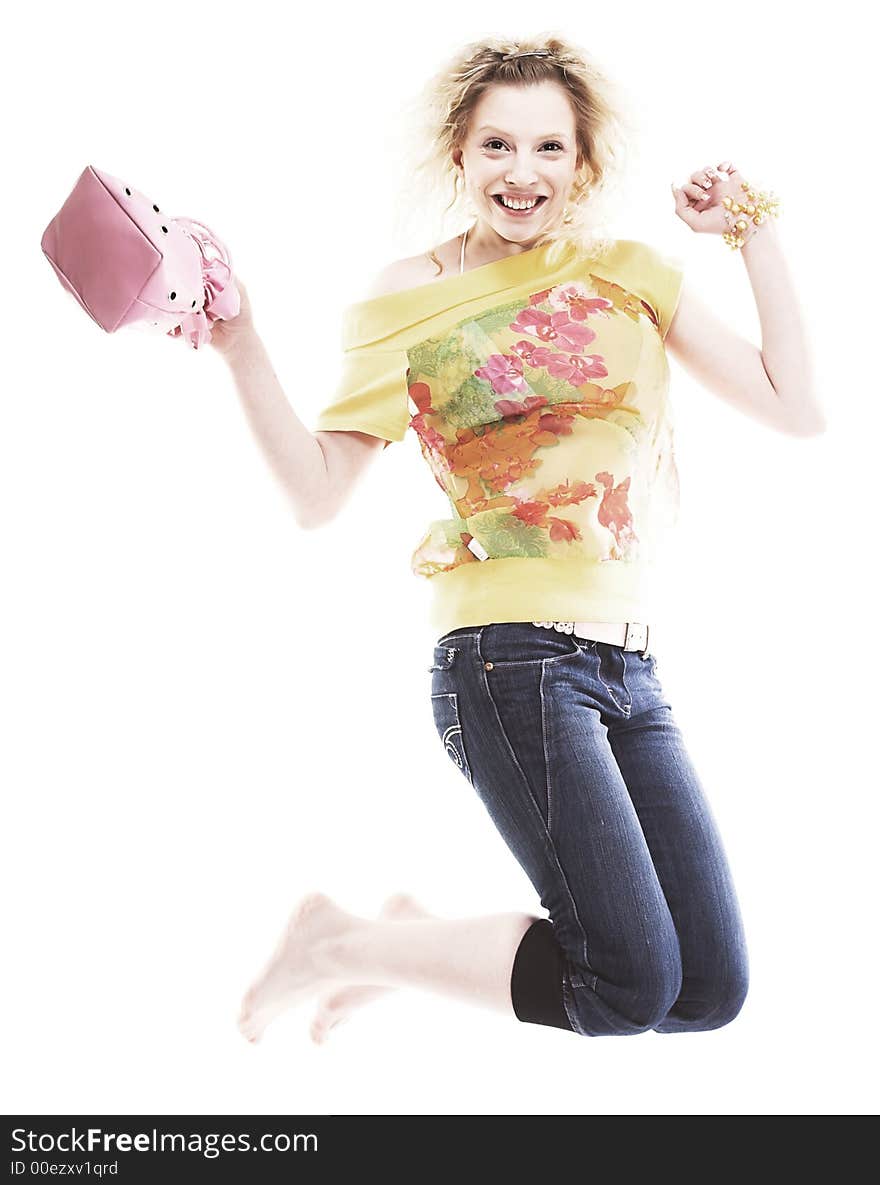 Girl jumping of joy over white