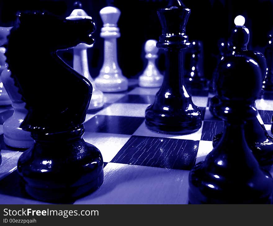Chess of a figure on chess board. Dark blue colour