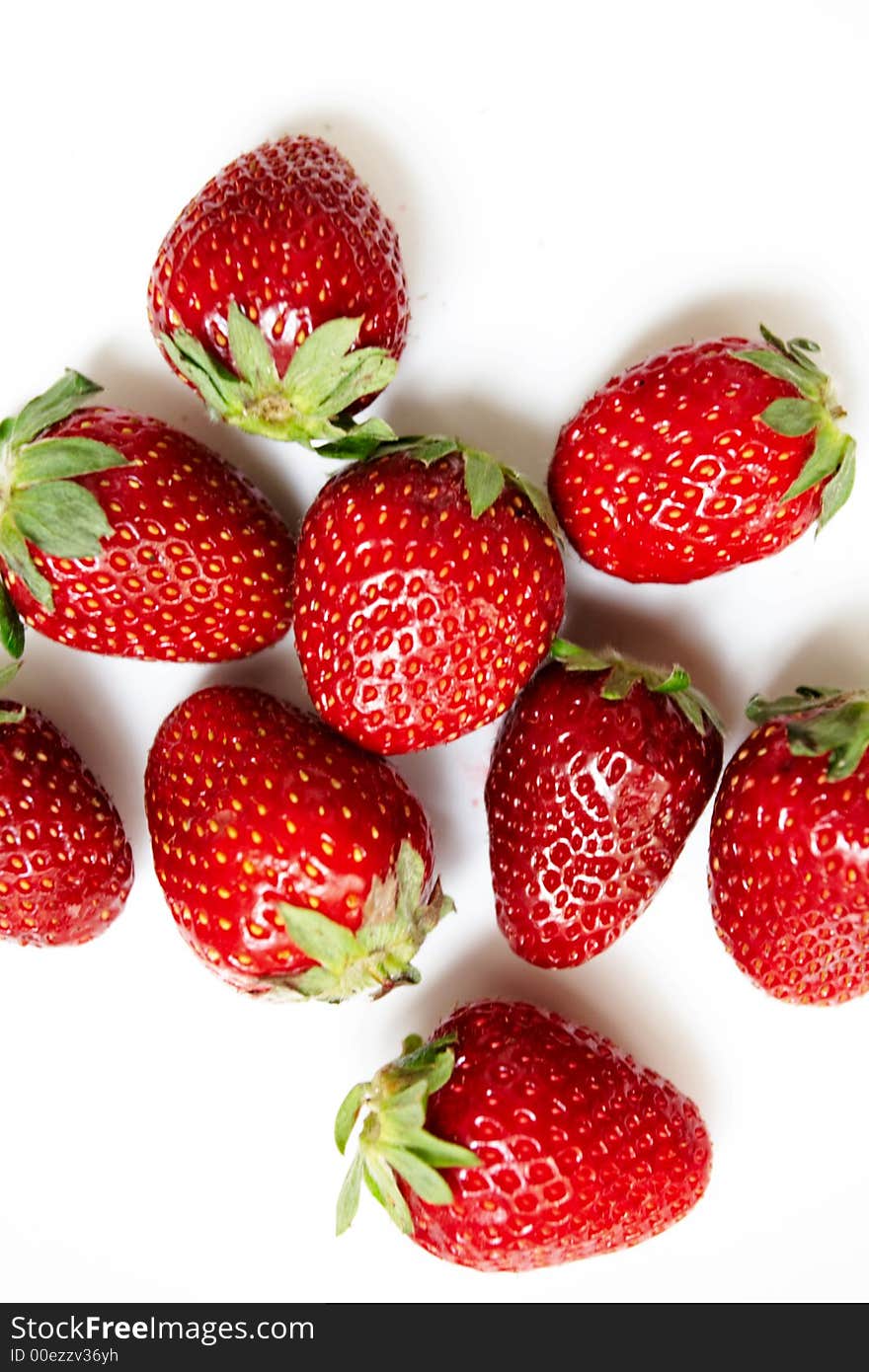 Nine ripe strawberries on a white background