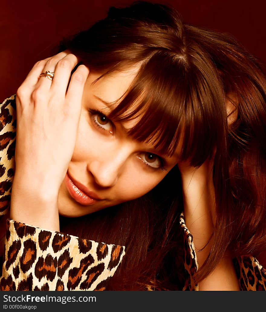 Close-up portrait of a beautiful woman in brown colours