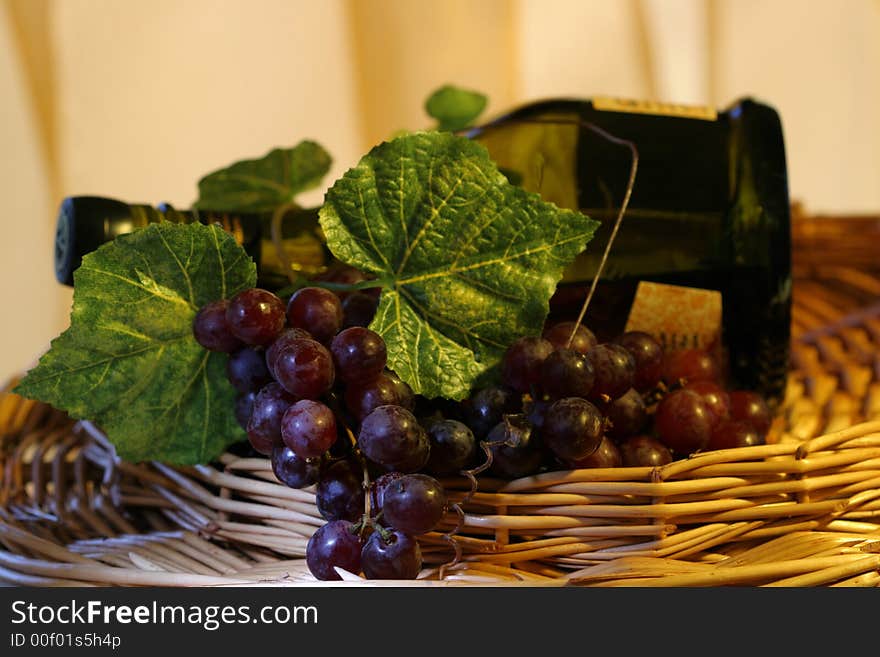 Grapevine, leaf and wine in a basket. Grapevine, leaf and wine in a basket