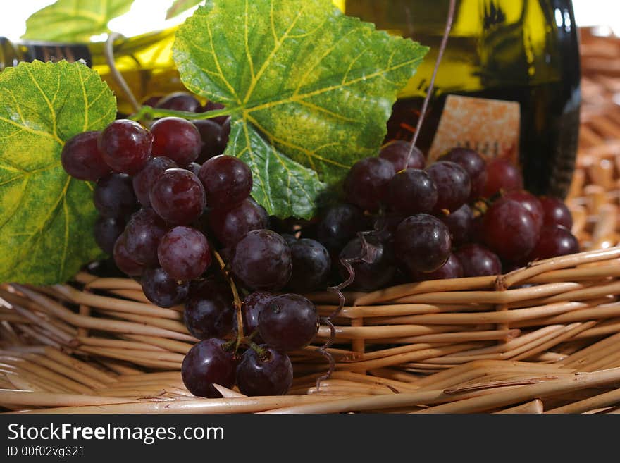 Grapevine, leaf and wine in a basket. Grapevine, leaf and wine in a basket