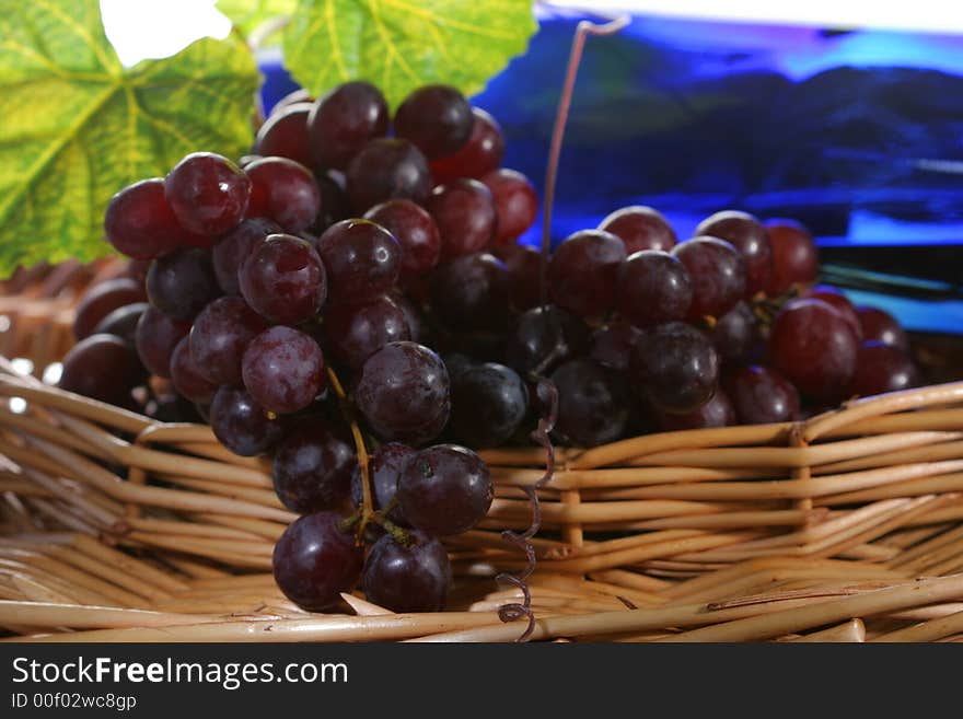 Grapevine, leaf and wine in a basket. Grapevine, leaf and wine in a basket