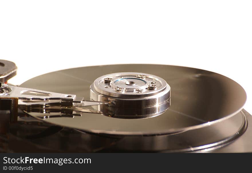 Opened hard drive on white background, closeup of head and disc. Opened hard drive on white background, closeup of head and disc