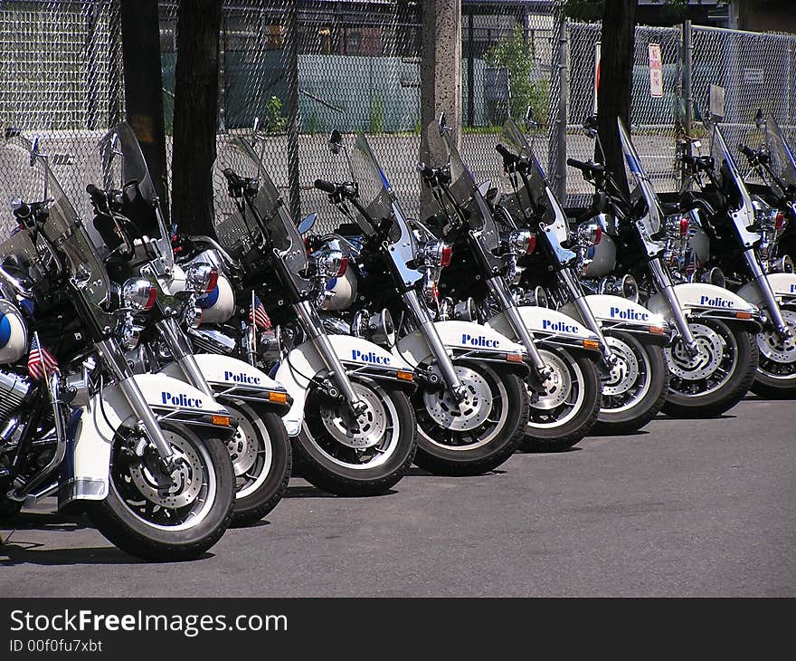 Police motor cycles parked on the street