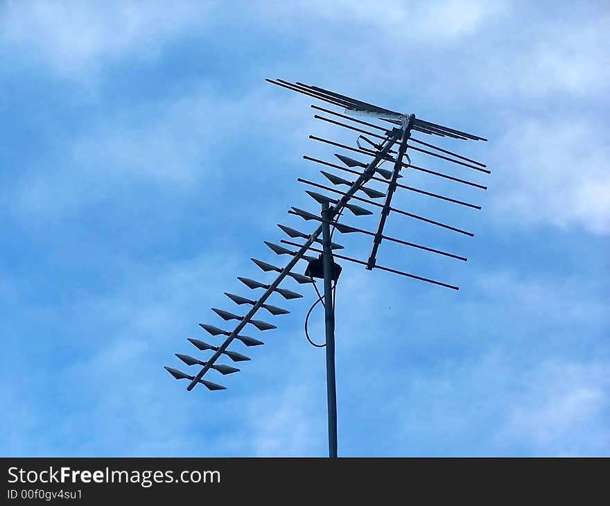 Arrow shaped aerial transmitter with pretty blue sky background. Arrow shaped aerial transmitter with pretty blue sky background.