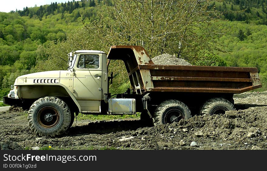 Old dump truck working on a construction site in Chilliwack, BC. Old dump truck working on a construction site in Chilliwack, BC