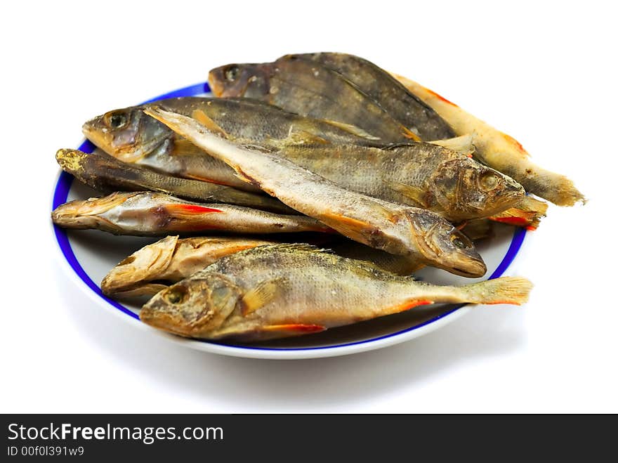 Beautiful the dried perch on a plate on a white background. Beautiful the dried perch on a plate on a white background