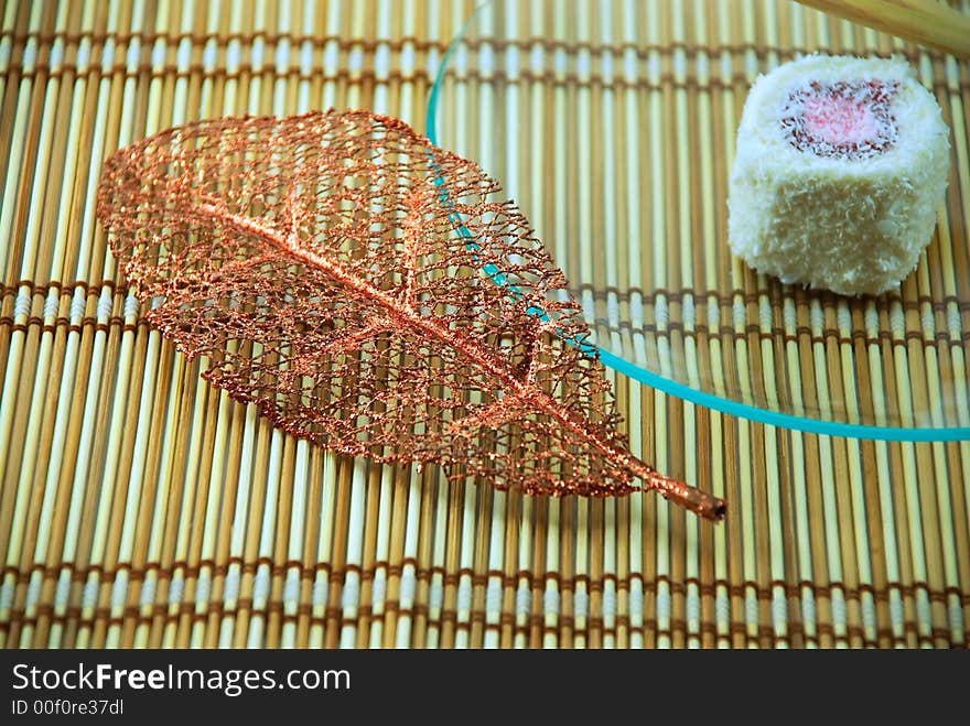 Beautiful cake in a plate on a bamboo napkin