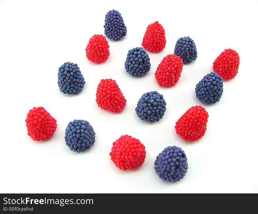 Beautiful fruit candy as berries on a white background