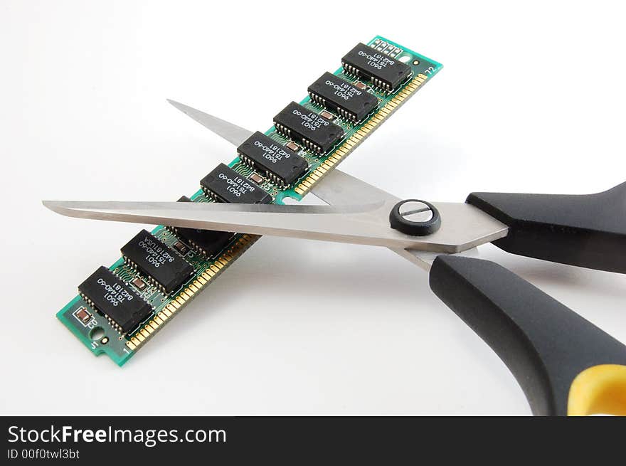 Scissors cutting computer chip