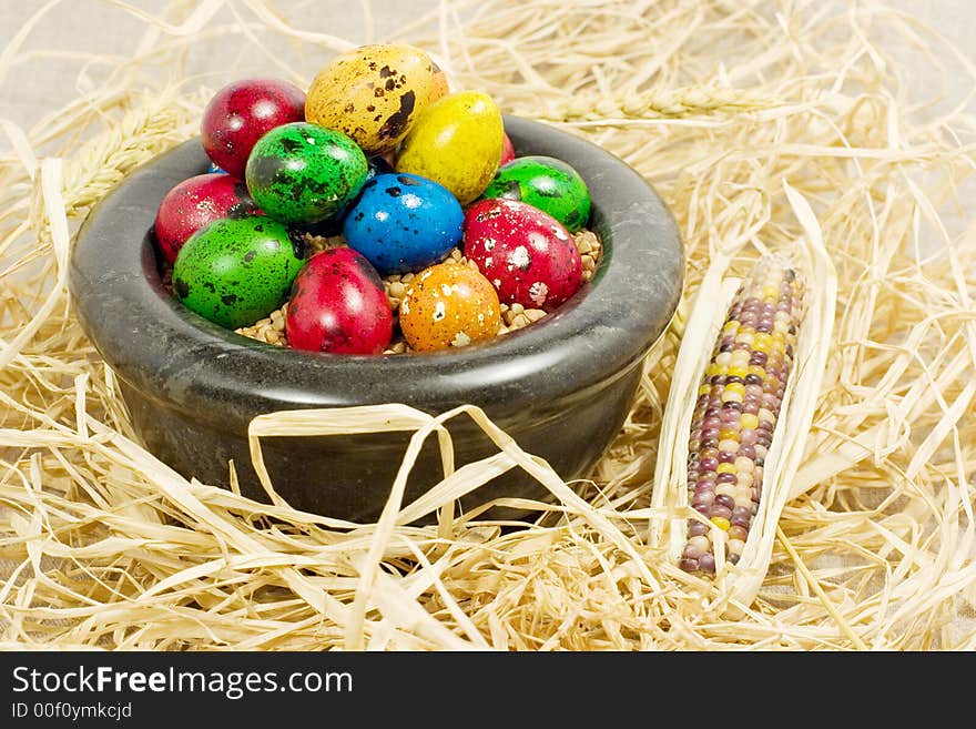 Colorful eggs in bowl