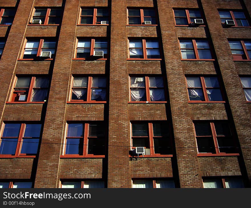 Sun sets on windows of the front wall of art studio building. Sun sets on windows of the front wall of art studio building