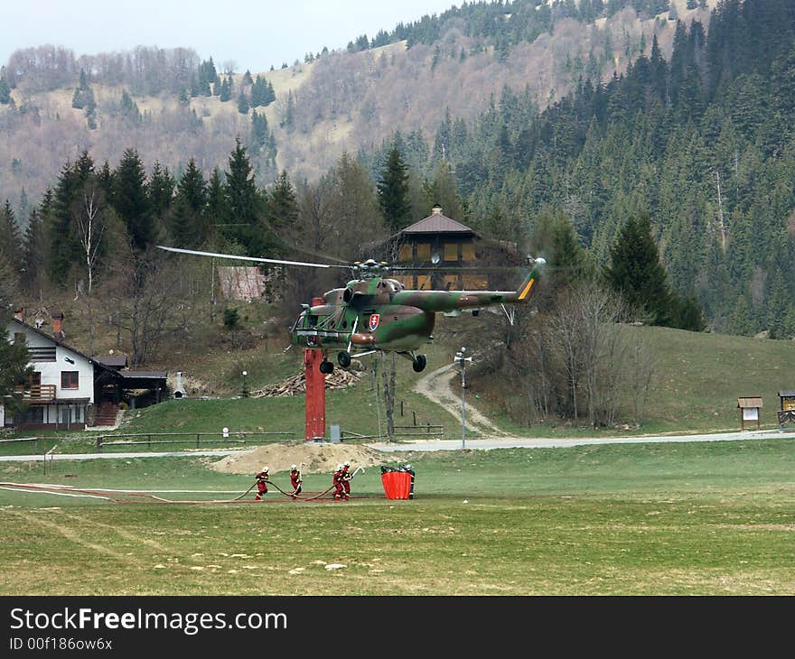 Fire-fighter And Helicopter