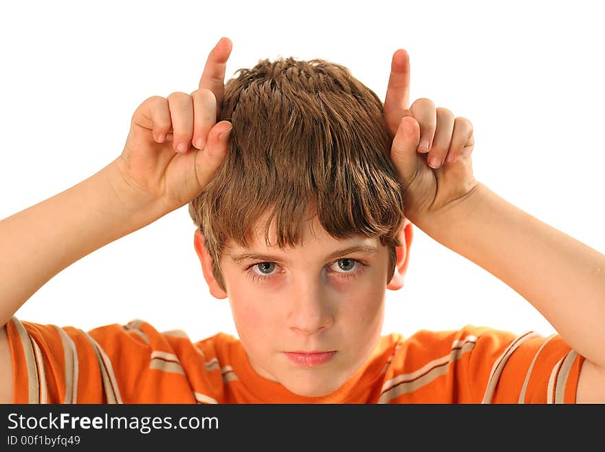 Photo of a young boy with horns isolated on white