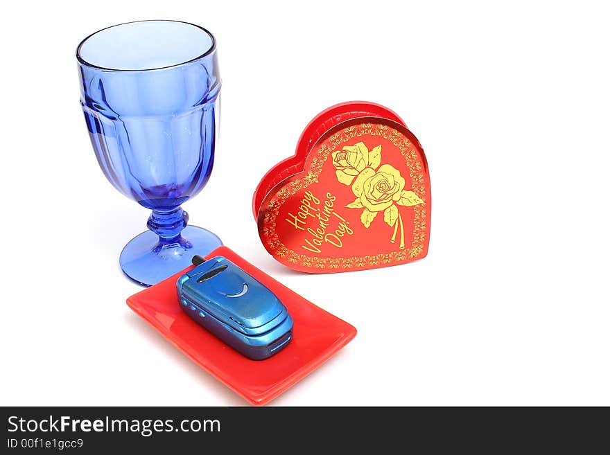 Isolated photo of a heart cellphone and glass level. Isolated photo of a heart cellphone and glass level