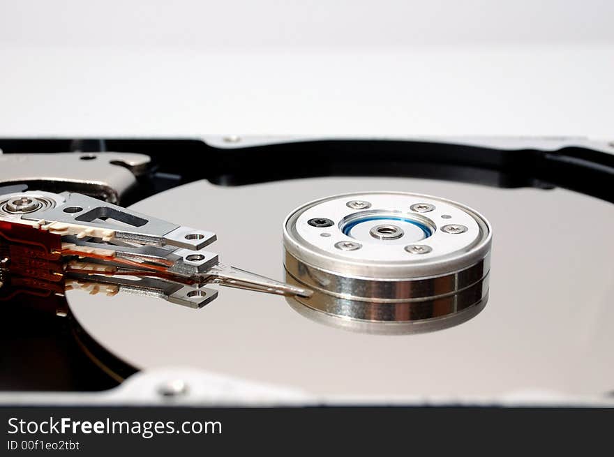 Close-up of an opened hard disk drive. Close-up of an opened hard disk drive