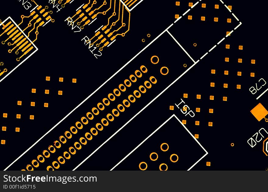 A close up of black and gold circuit plate. A close up of black and gold circuit plate