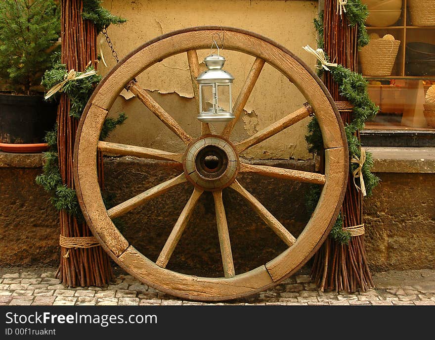 Close up on wooden wheel on Prague street