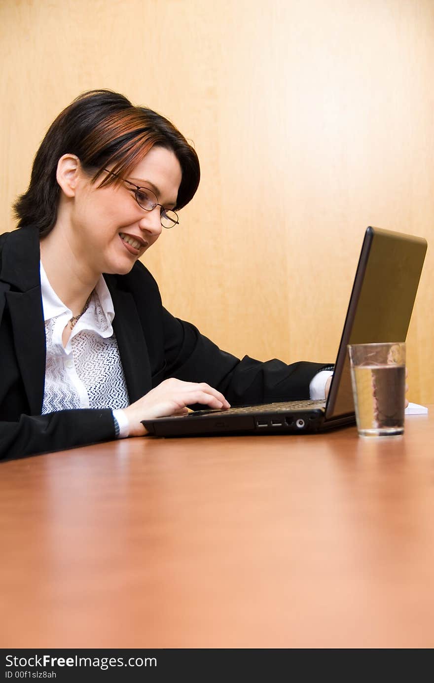 Business woman working hard on her laptop. Business woman working hard on her laptop