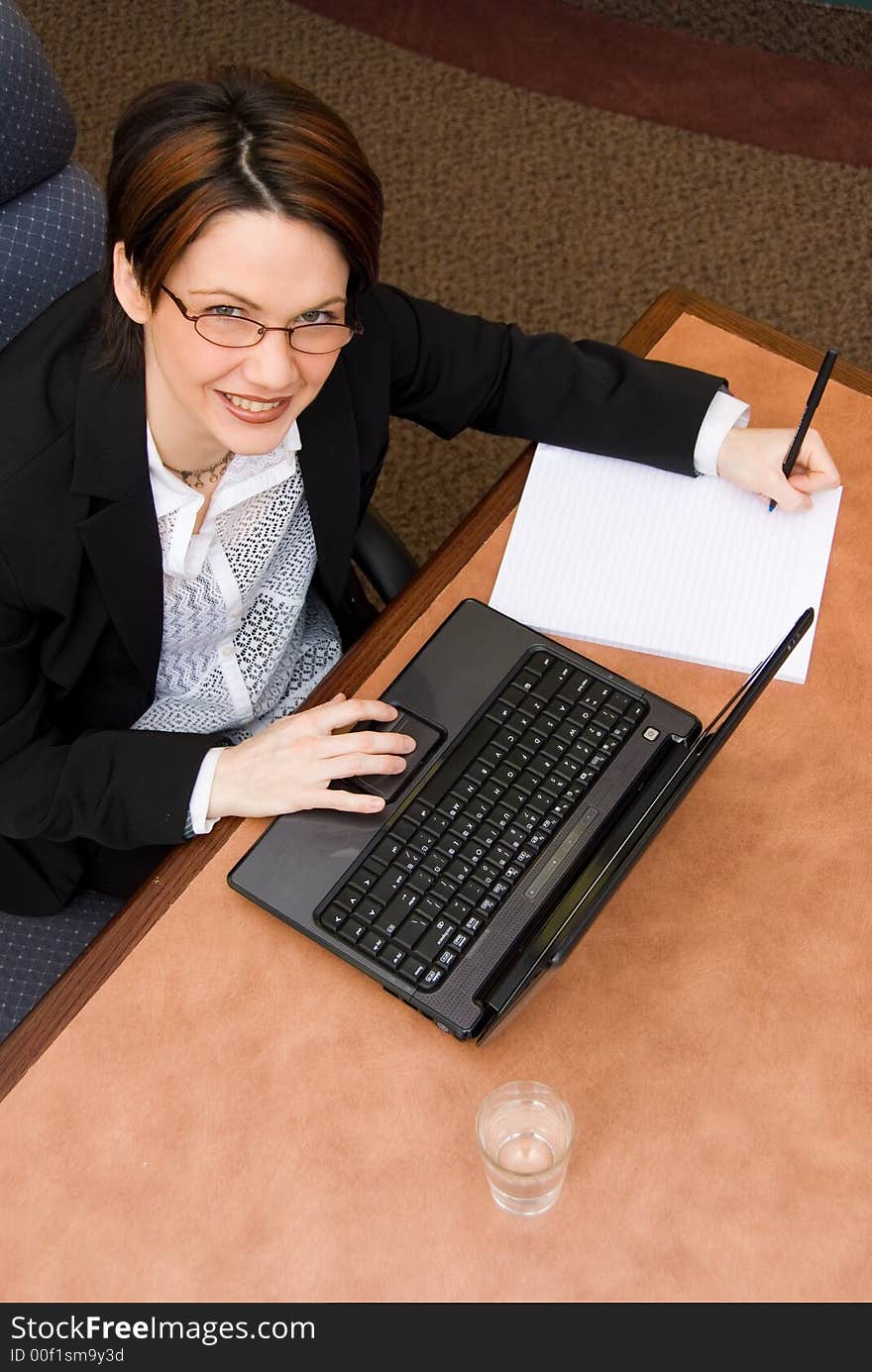 Happy woman in a business meeting room. Happy woman in a business meeting room